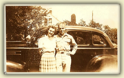 Warren, still in army garb, with Betty Jean in front of a '40s car